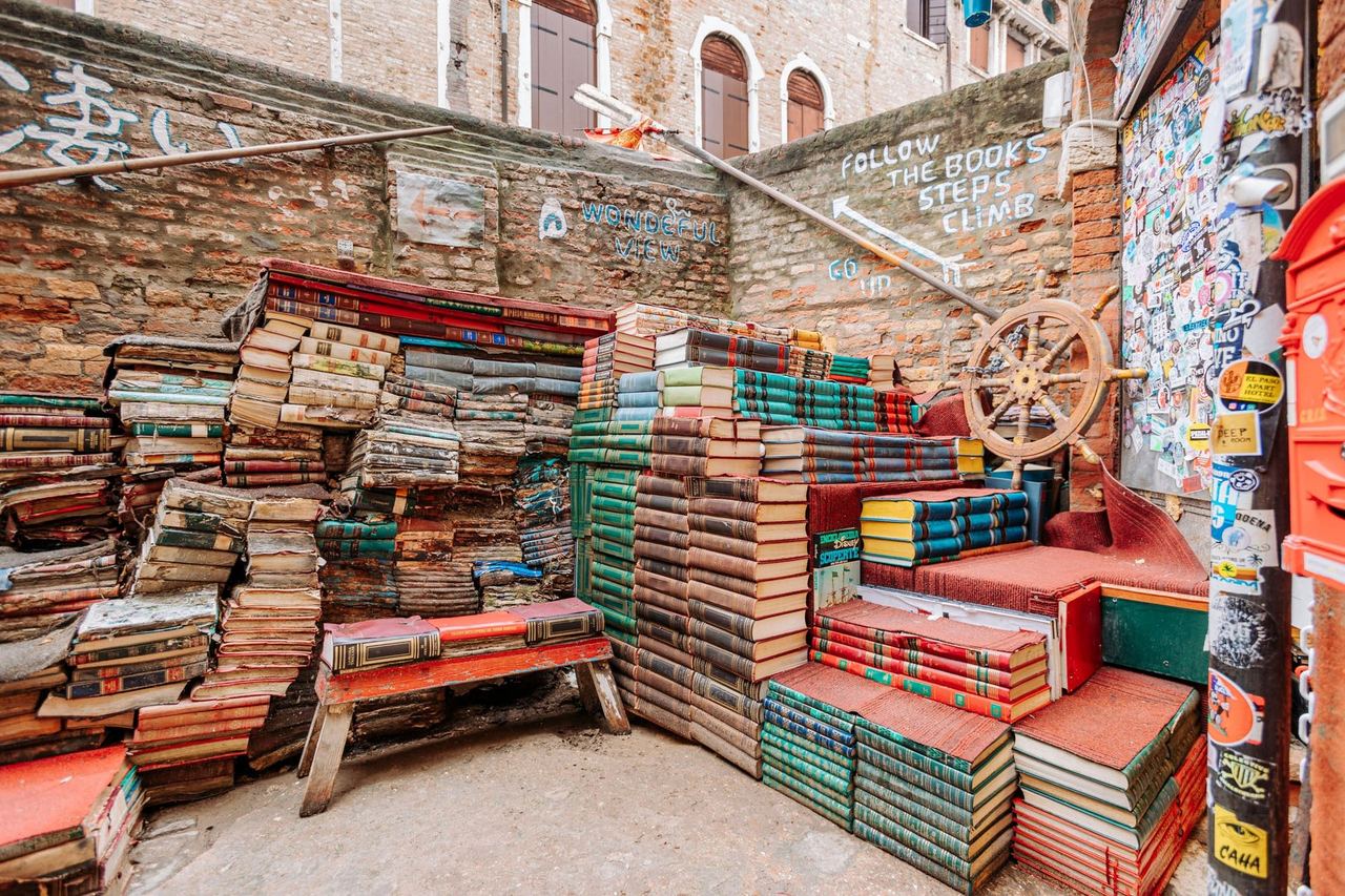 The staircase of old books in the courtyard of Libreria Acqua Alta